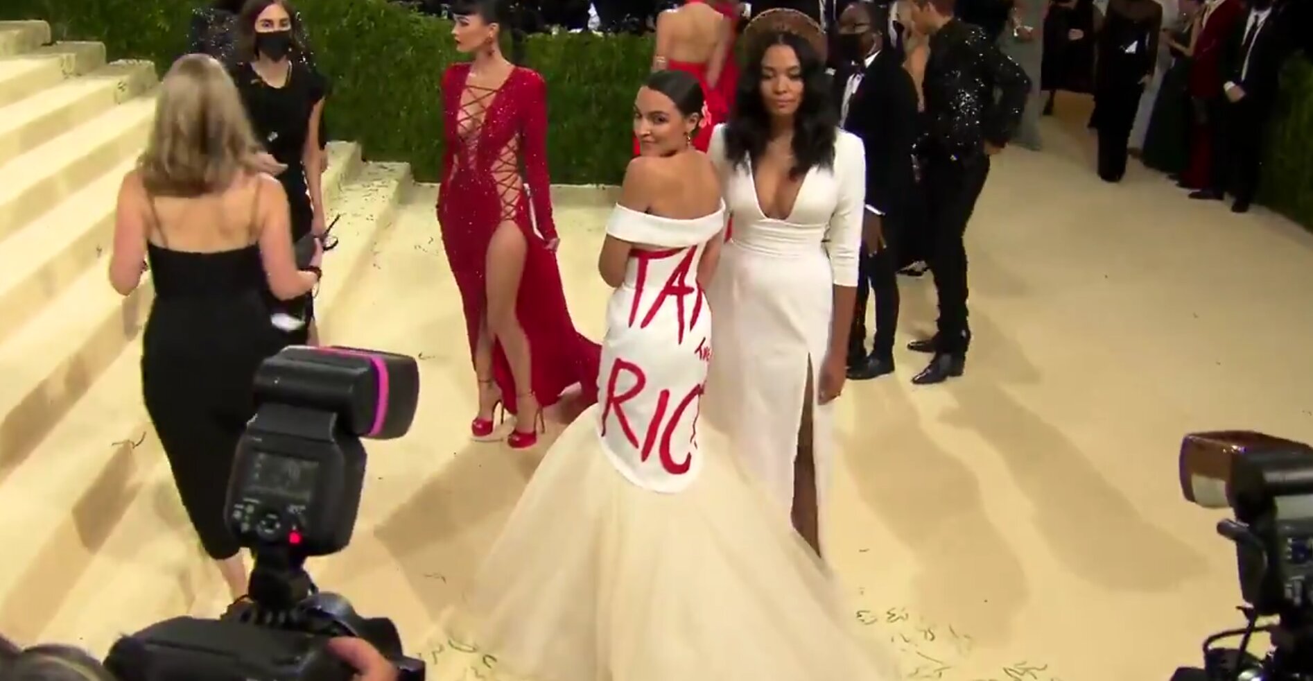 AOC Arrives at Met Gala Wearing ‘Tax the Rich’ Dress