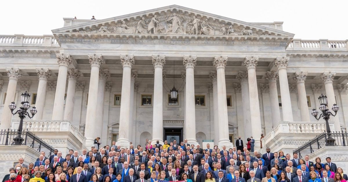 Republicans and Democrats Proudly Pose on Steps of Capitol With American Flag Desecrated for Ukraine