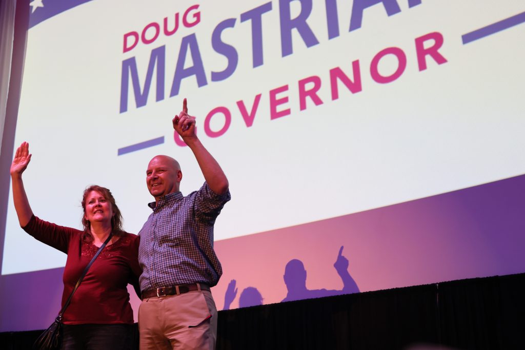 WARMINSTER, PENNSYLVANIA â MAY 14: Pennsylvania Republican gubernatorial candidate Doug Mastriano and his wife Rebbeca wave to the crowd after the conclusion of his speech during a campaign rally at The Fuge on May 14, 2022 in Warminster, Pennsylvania. (Photo by Michael M. Santiago/Getty Images)