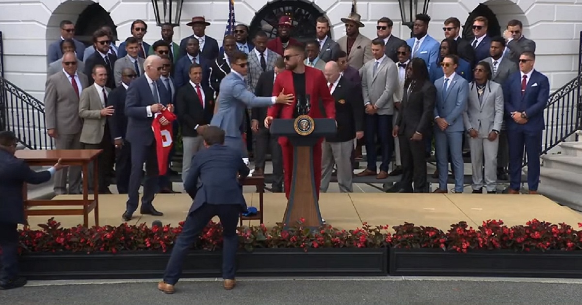 Chiefs Star Travis Kelce Tells Biden, ‘Stay Right There,’ Then Tries to Commandeer His Podium
