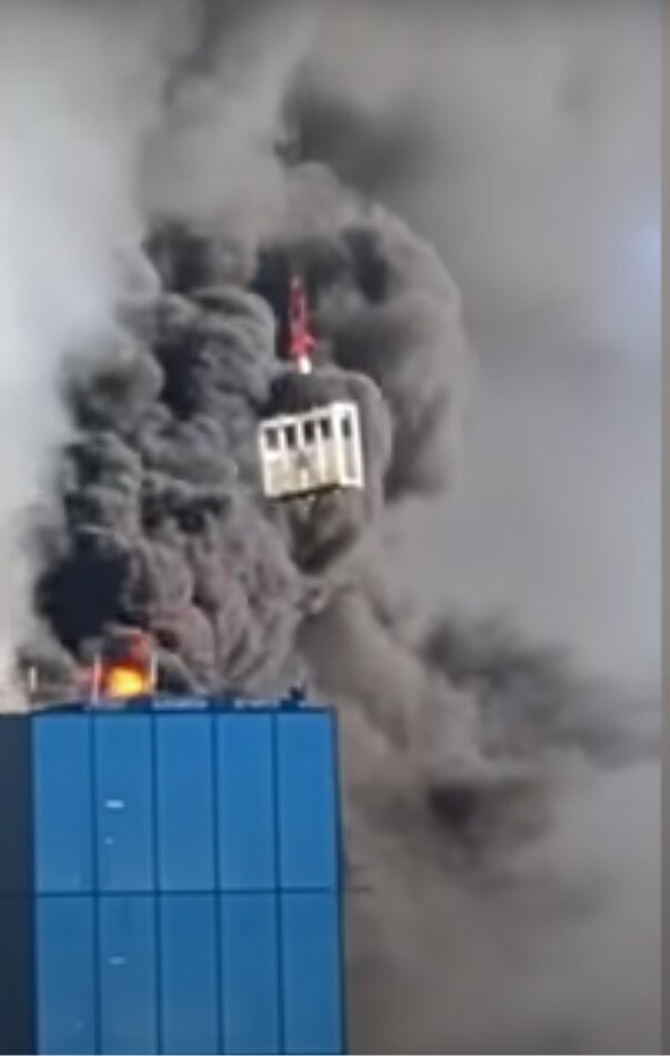 Crane Worker Saves Man Trapped Atop Burning Building