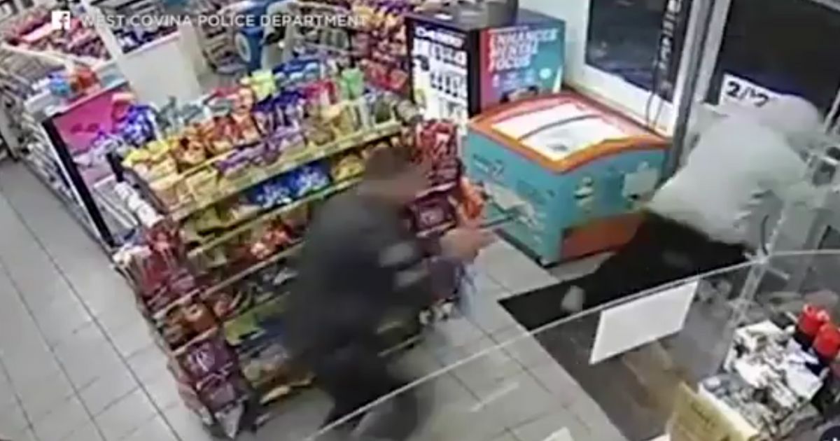 Clerk in Middle of Armed Robbery Is Busy Loading Cash Bag When the Perfect Customer Walks In