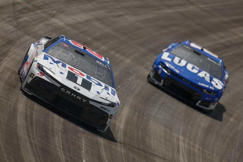 DOVER, DELAWARE – MAY 17: Christopher Bell, driver of the #20 Mobil 1 Toyota, and Kyle Busch, driver of the #8 Lucas Oil Chevrolet, race during the NASCAR Cup Series All-Star Race at Dover Motor Speedway on May 17, 2026 in Dover, Delaware. (Photo by Meg Oliphant/Getty Images)