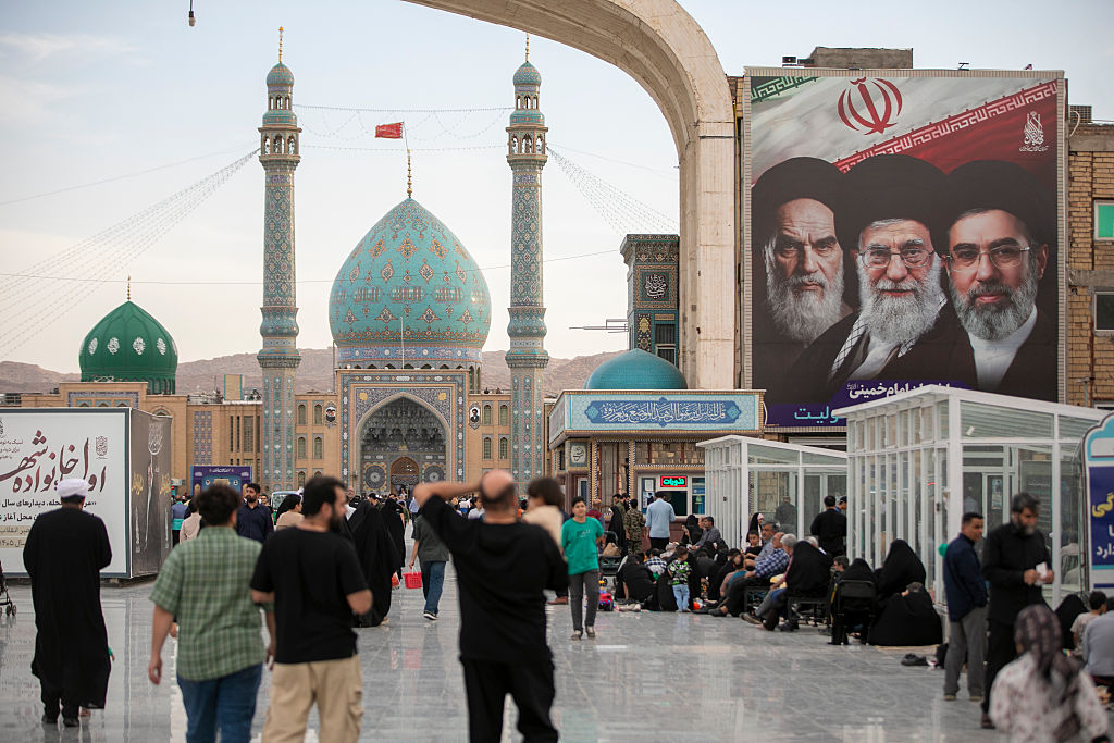 QOM, IRAN – MAY 26: A banner with images of Iran’s late and new supreme leaders, Ayatollah Ruhollah Khomeini, Ayatollah Ali Khamenei, and Ayatollah Mojtaba Khamenei is seen at the entrance of Jamkaran Mosque during Eid al-Adha on May 26, 2026 in Qom, Iran. Eid al-Adha (the Festival of Sacrifice) is one of the most sacred holidays in Islam, expected to be celebrated from 26–27 May 2026 until 29–30 May 2026 depending on regional moon sightings. It honors the willing of Prophet Ibrahim to sacrifice his son, Ismail, in obedience to God’s command and marks the conclusion of the annual Hajj pilgrimage to Mecca. (Photo by Majid Saeedi/Getty Images)