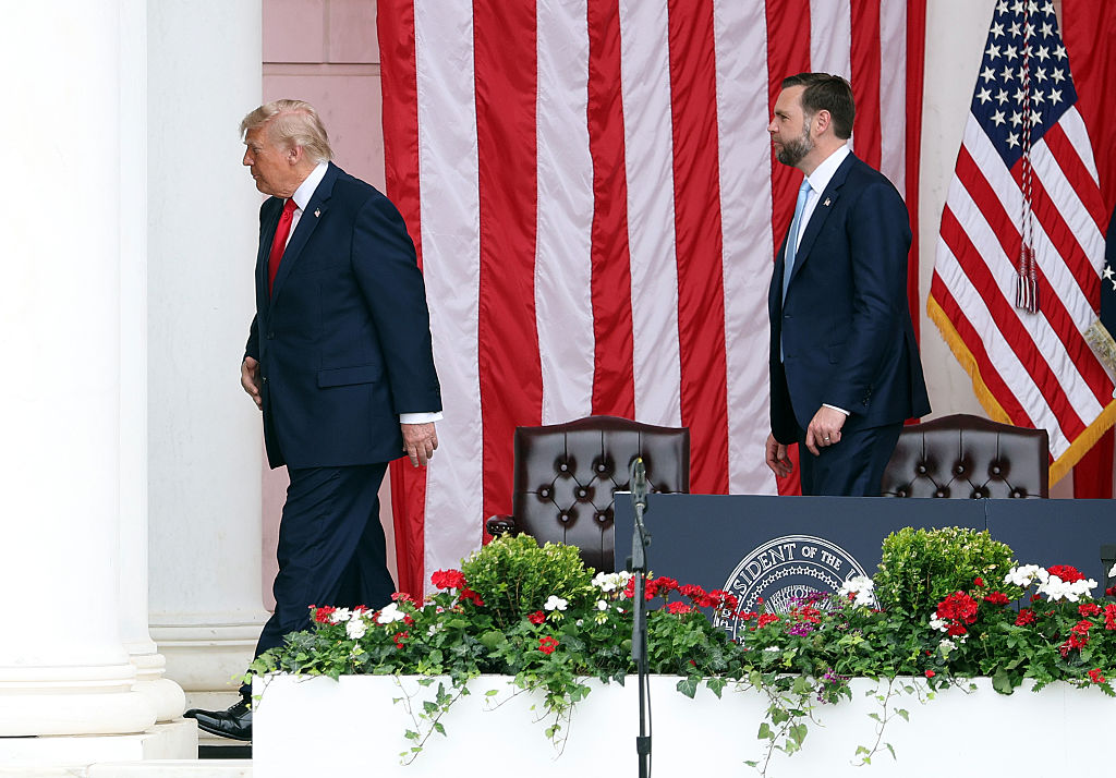 ARLINGTON, VIRGINIA – MAY 25: U.S. President Donald Trump (L) and U.S. Vice President JD Vance leave the stage after delivering remarks during a Memorial Day ceremony at Arlington National Cemetery on May 25, 2026 in Arlington, Virginia. Memorial Day honors those who died while serving in the U.S. armed forces. (Photo by Kevin Dietsch/Getty Images)